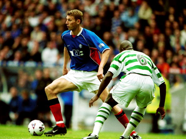 30 Sep 2001:  Tore Andre Flo of Rangers takes on Bobo Balde of Celtic of during the Rangers v Celtic match in the Scottish Premier League at Ibrox ...