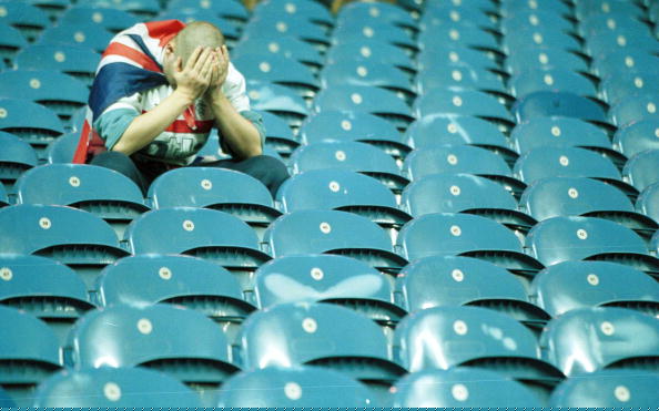 7 Nov 2000:  A dejected Rangers fan lholds his head in despair after the Champions League Group D match between Rangers and Monacco played at Ibrox...