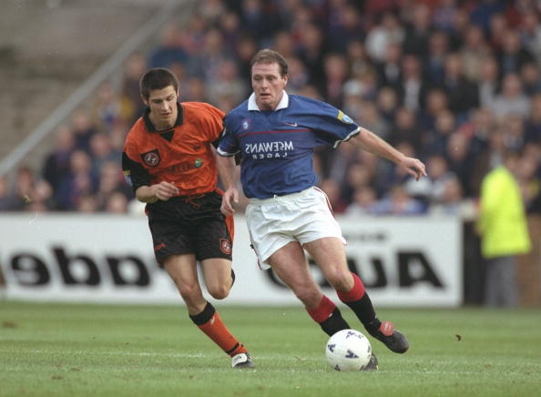 25 Oct 1997:  Paul Gascoigne of Rangers (right) takes on Graig Easton of Dundee during the Scottish Premier League match at Ibrox in Glasgow, Scotl...