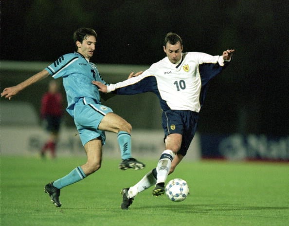 7 Oct 2000:  Don Hutchison of Scotland beats Ermanno Zonzini of San Marino during the World Cup 2002 Group 6 Qualifying match played at the Interna...