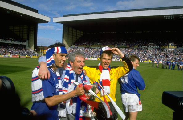11 May 1991:  Mark Hately (left), Walter Smith (centre) and Chris Woods (right) of Rangers celebrate with the trophy after winning the Scottish Pre...