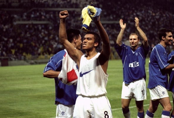 25 Aug 1999:  Giovanni van Bronckhorst of Rangers celebrates victory over Parma in the UEFA Champions League qualifying third round second leg matc...