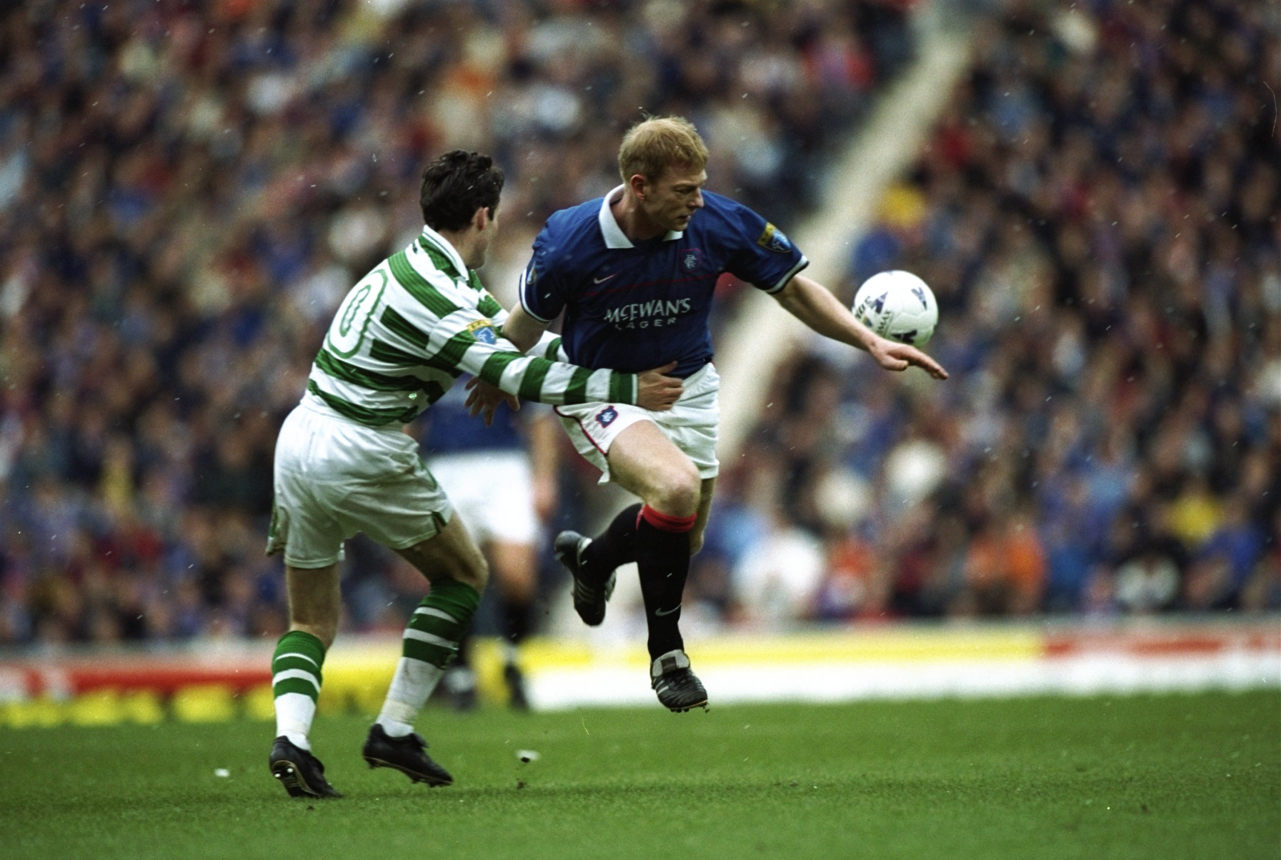 12 Apr 1998:  Jorg Albertz of Rangers takes on Paul Lambert of Celtic during the match between Glasgow Rangers v Celtic in the Bells Scottish Premi...