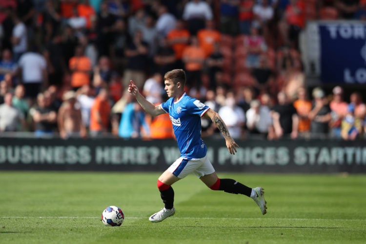 BLACKPOOL, ENGLAND - JULY 16: Charlie McCann of Rangers runs with the ball during the Pre-Season Friendly match between Blackpool and Rangers at Bl...