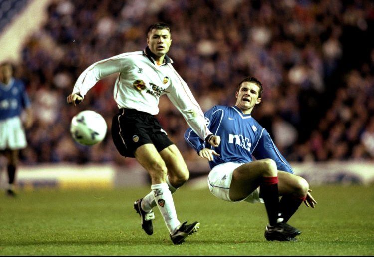 26 Oct 1999:  Adrian Ilie of Valencia is challenged by Barry Ferguson of Rangers during the Champions League match played at Ibrox Stadium in Glasg...