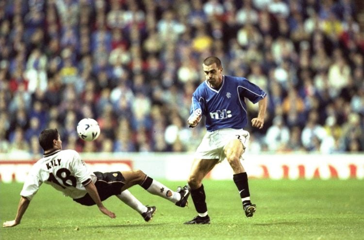 26 Oct 1999:  Sergio Porrini of Rangers is tackled by Kily Gonzalez of Valencia during the Champions League match played at Ibrox Stadium in Glasgo...