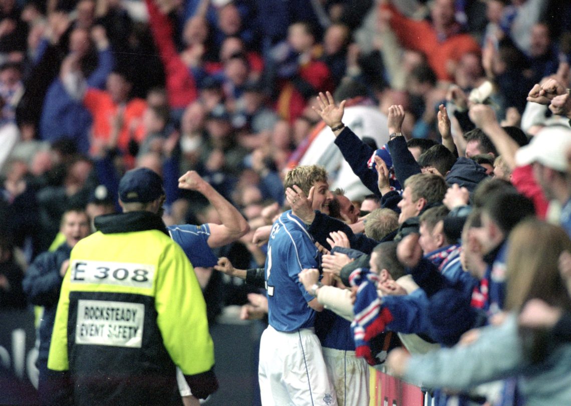 26 Nov 2000:  Tore Andre Flo of Rangers celebrates with fans after scoring during the Scottish Premier League match against Celtic played at Ibrox,...