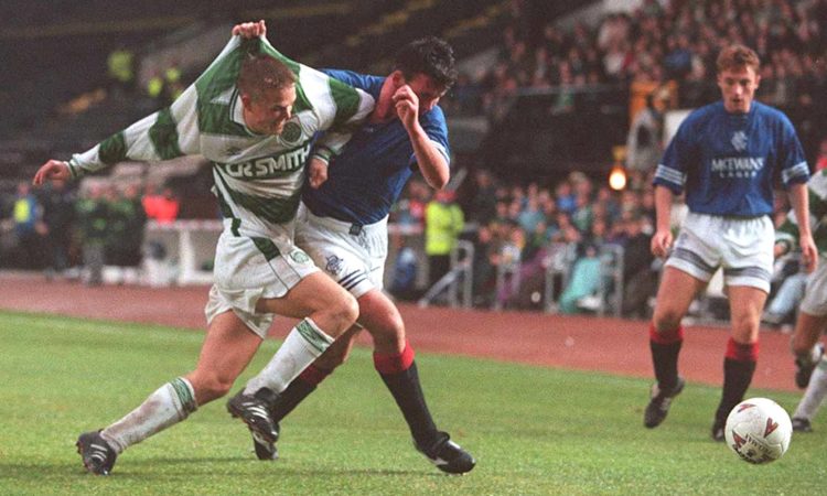 30 OCT 1994:  SIMON DONNELLY OF CELTIC IS LIFTED UP BY THE SHIRT BY NEW RANGERS PLAYER ALAN MCLAREN AS THE FIGHT FOR THE BALL IN THEIR SCOTTISH PRE...