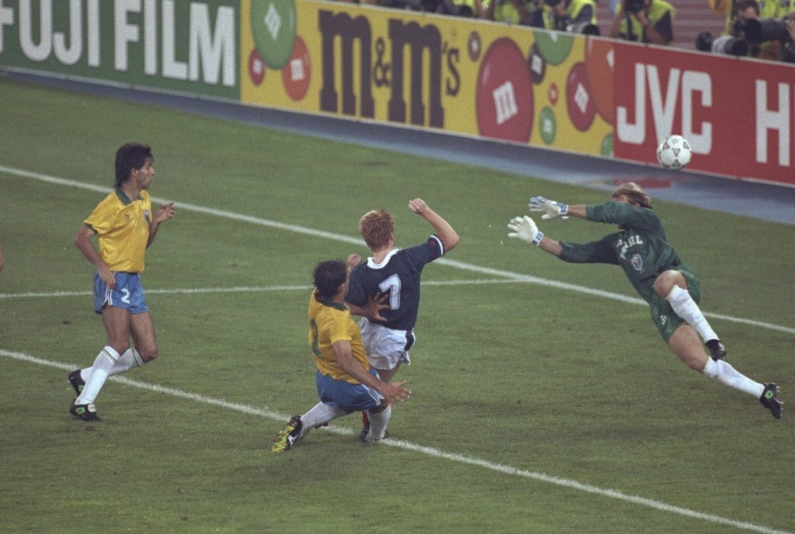 20 Jun 1990: Mo Johnson (second right) of Scotland is tackled as he narrowly misses scoring in the closing stages during the World Cup match again...