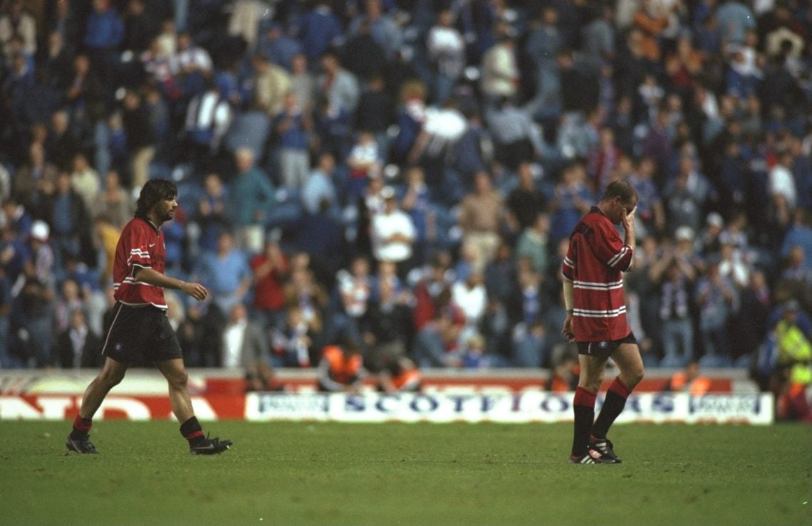 13 Aug 1997: Paul Gascoigne (right) and Marco Negri of Rangers walk off the field after the first leg of the Champions League match against IFK G...
