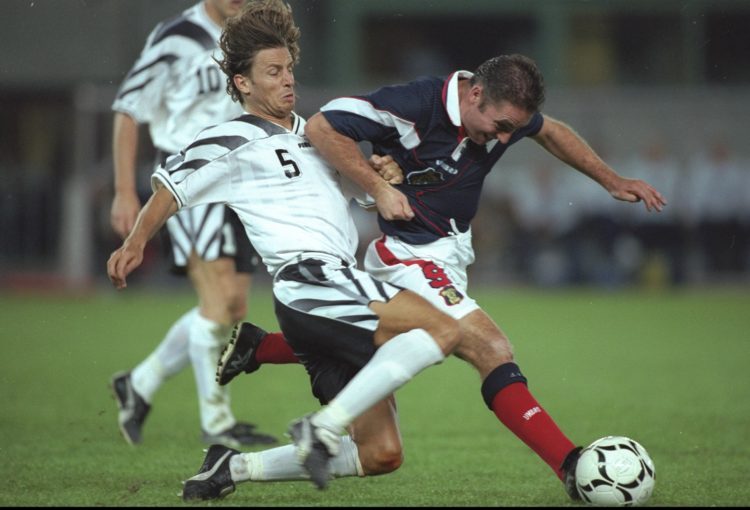 31 Sep 1997:  Ally McCoist of Scotland takes on the Austrian #5 during the World Cup qualifying match in Vienna, Austria. The match ended in a 0-0 ...