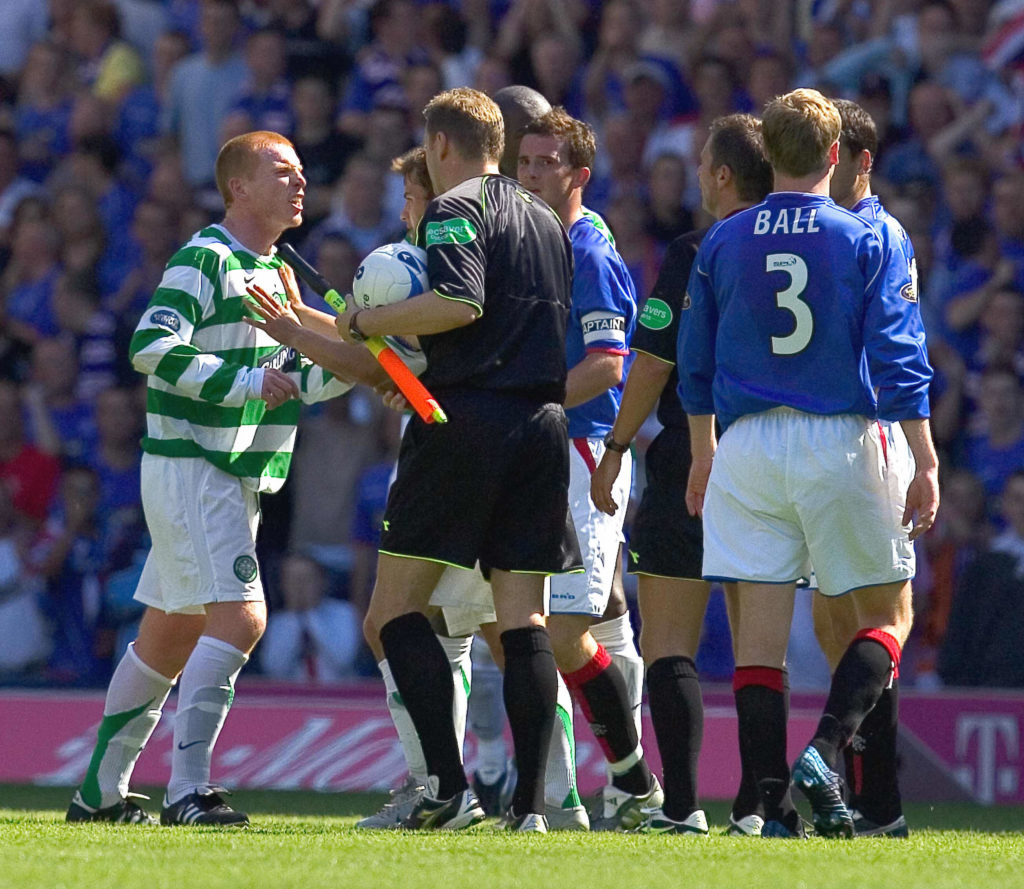 Neil Lennon (L) argues with match offici