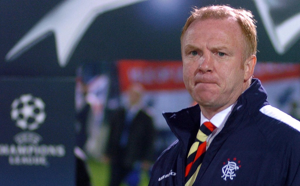 Alex McLeish looks on.