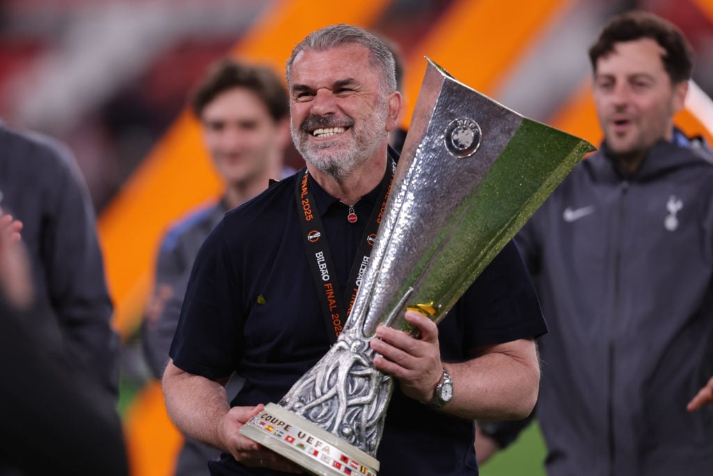 Ange Postecoglou celebrates a Europa League win.