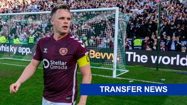 Lawrence Shankland looks on.